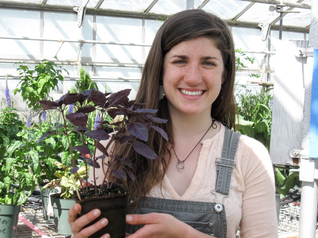 Student holding plant