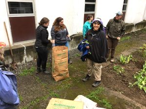 Student volunteers working in Murray Hall courtyard on Maine Day