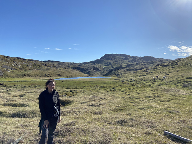 Serena Laro standing outdoors with an alpine landscape in the background