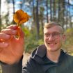 Ben VanderStouw holding up a mushroom