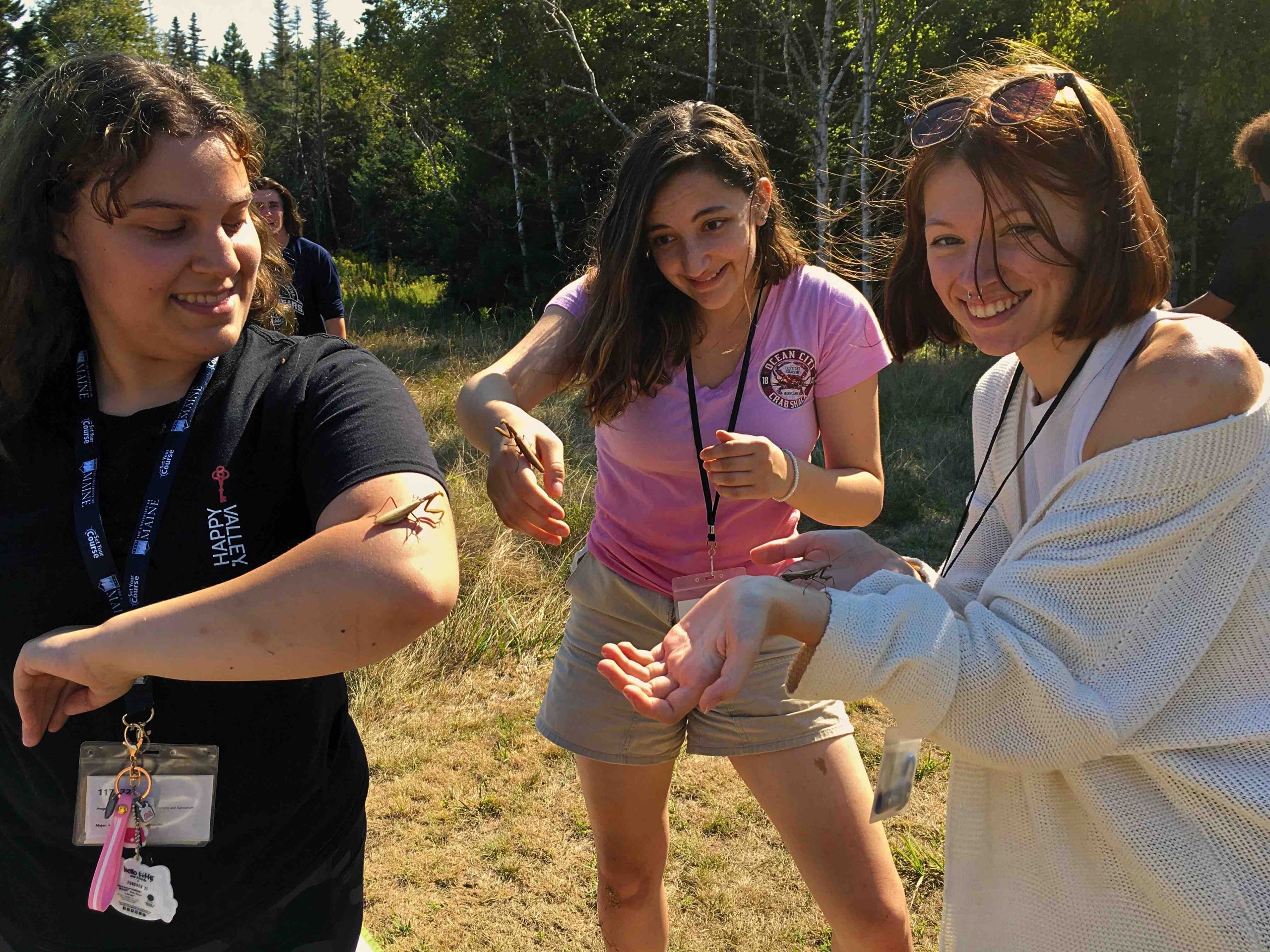 Students participating in RLe holding praying mantis