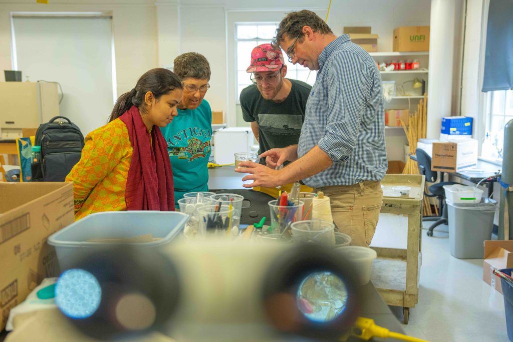 Philip Fanning studies a small parasitic wasp that finds small flies that burrow into blueberries and lays it's eggs inside them. This is a method of pest control. 082722